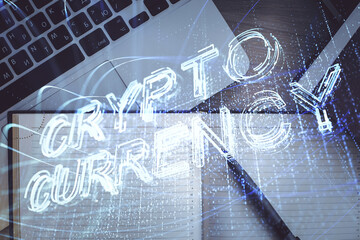 Blockchain theme hologram drawings over computer on the desktop background. Top view. Double...