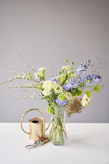 Finished flower arrangement in a vase for home. Flowers bunch, set for interior. Fresh cut flowers...