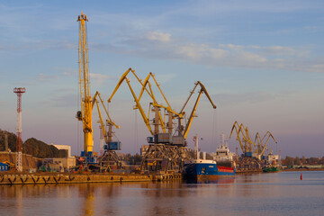 Fototapeta na wymiar View of the berths of the Vyborg cargo port on a sunny October evening