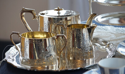 Pots and other silverware on the table