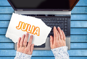 Julia Programming Language.  Word Julia on paper and laptop  - obrazy, fototapety, plakaty