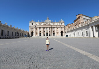 Alone little girl  in the Saint Peter Square in Vatican City during lockdown