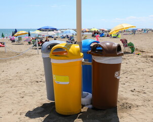 foure bins for separate waste collection on the beach of the Resort by the sea