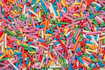 Sugar sprinkles, decorations for cake and pastry, a lot of sprinkles as a background 