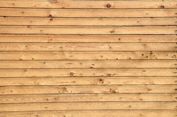 Fototapeta premium The fence wall is made of wooden boards.