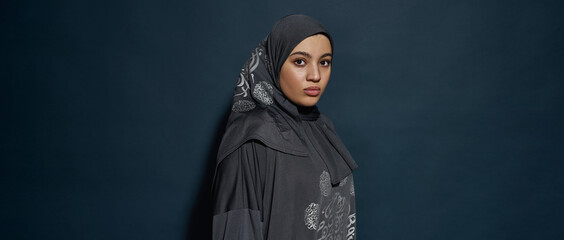 Young arabian girl in hijab posing sideways