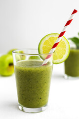 Homemade vegetable green smoothie with apple, cucumber, mint and lime