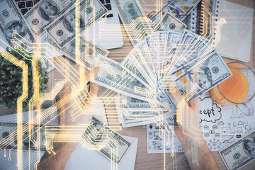 Multi exposure of Tech drawing hologram and USA dollars bills and man hands. Technology concept.