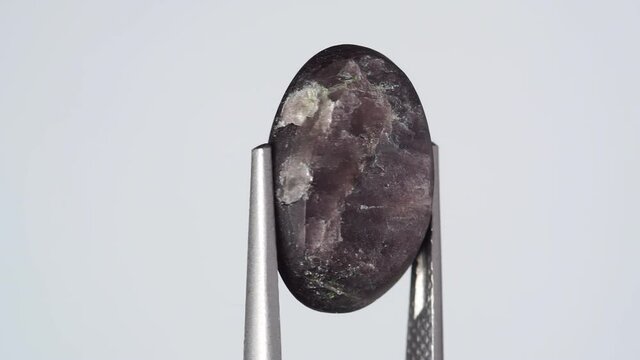 natural scapolite gemstone on the white turning table