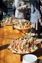 Sandwiches, canapes and cakes on the festive table. A wide variety of snacks