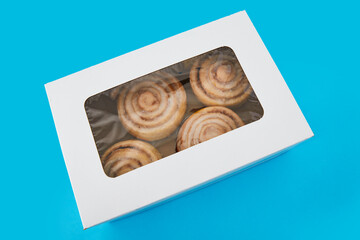 Box with some delicious cinnamon rolls