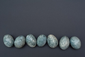 Marble Easter eggs on a dark background. 