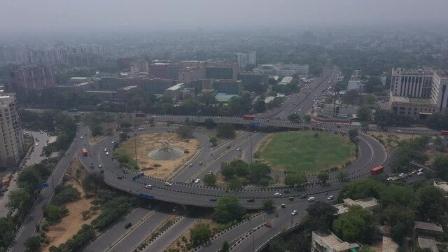 An aerial shot of the AIIMS flyover with running traffic during the COVID-19 pandemic in New Delhi, India
