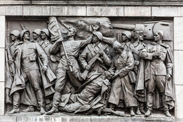 Minsk, Belarus. Bas-relief Scenes On Wall Of Stele Dedicated To Memory Of The Great Patriotic War....