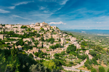 Fototapeta na wymiar Gordes, Provence, France. Beautiful Scenic View Of Medieval Hilltop Village Of Gordes. Sunny Summer Sky. Famous Landmark.