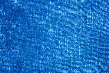 close up of blue jean or denim fabric that some area are faded, it is art of blue jean