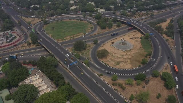 An aerial shot of the AIIMS flyover with running traffic during the COVID-19 pandemic in New Delhi, India
