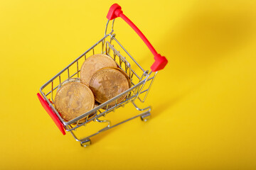 Bitcoins in the Cart. Concept: Purchase of Cryptocurrency.