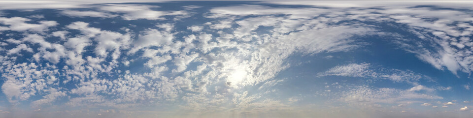 Seamless cloudy blue sky hdri panorama 360 degrees angle view with zenith and beautiful clouds for use in 3d graphics as sky dome or edit drone shot
