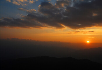 Nature Sky and White Clouds Texture Background - with orange light of sunset 