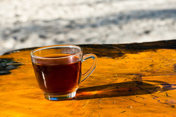 Cup of tea on the wooden table. seaside lipe. Thailand