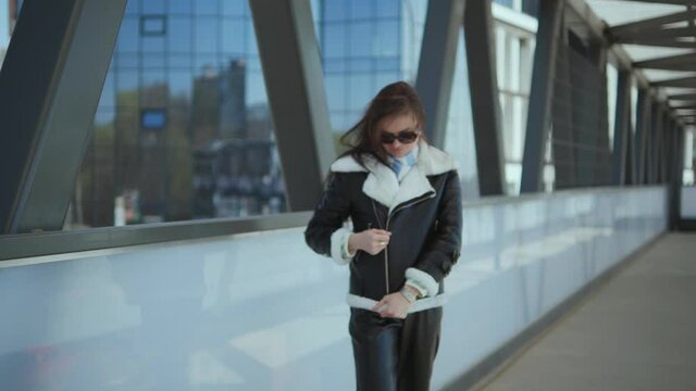 Stylish girl on the bridge.slow motion