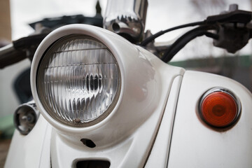 Old vintage scooter close-up. Old vintage moped close-up.