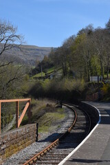  the unique train station of Berwyn in wales, which is a station that is on top of a bridge that goes over another bridge