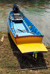 Thailand wood transport boat parking at riverside