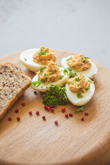 Eggs stuffed with tuna, parsley and onion. Tuna stuffed deviled eggs. 