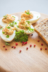 Eggs stuffed with tuna, parsley and onion. Tuna stuffed deviled eggs. 