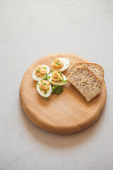 Eggs stuffed with tuna, parsley and onion. Tuna stuffed deviled eggs. 