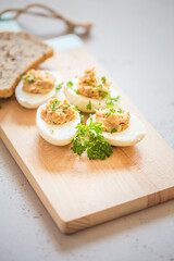 Eggs stuffed with tuna, parsley and onion. Tuna stuffed deviled eggs. 