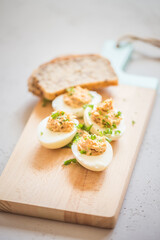 Eggs stuffed with tuna, parsley and onion. Tuna stuffed deviled eggs. 