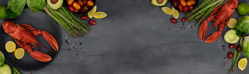 Banner of lobsters with vegetables and spices on grey concrete table. Seafood and vegetables.