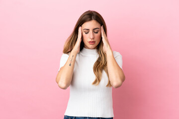 Caucasian woman isolated on pink background with headache
