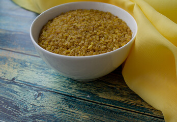 background. turquoise background. grits in a white bowl	
