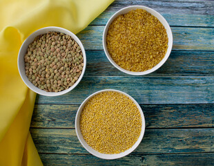 background. turquoise background. grits in a white bowl