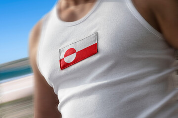 The national flag of Greenland on the athlete's chest