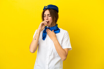 Airplane stewardess woman isolated on yellow background is suffering with cough and feeling bad