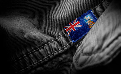 Tag on dark clothing in the form of the flag of the Falkland Islands