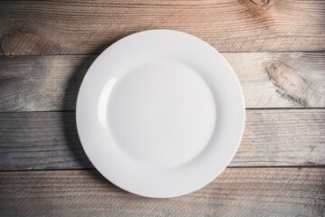Empty Dinner Plate On A Wooden Board