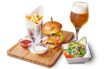 Hambuger and french fries with a glass of beer on wooden plank