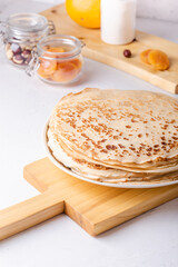 Stack of thin pancakes, ingredients, making blini crepes