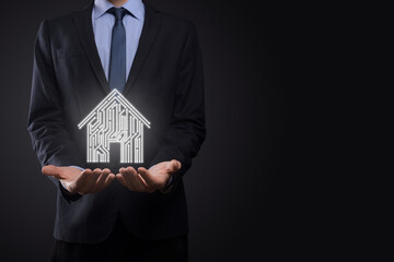 Businessman hold house icon.Smart home controlled, intelligent house, and home automation app...
