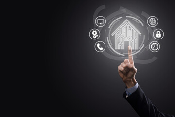 Businessman hold house icon.Smart home controlled, intelligent house, and home automation app concept.Pcb design and person with smart phone. Innovation technology internet Network Concept.