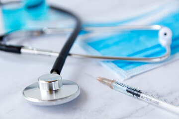 Vials and syringe on light background. Vaccination and immunization.