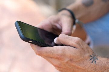 Young caucasian hiker man spending their camping vacations and write his friends