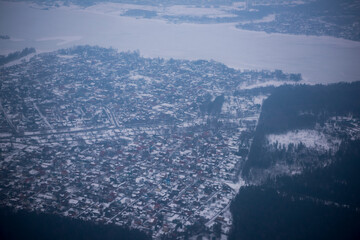 View of the snow-covered suburbs of Moscow from an airplane