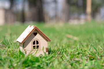 a small wooden house among the green grass